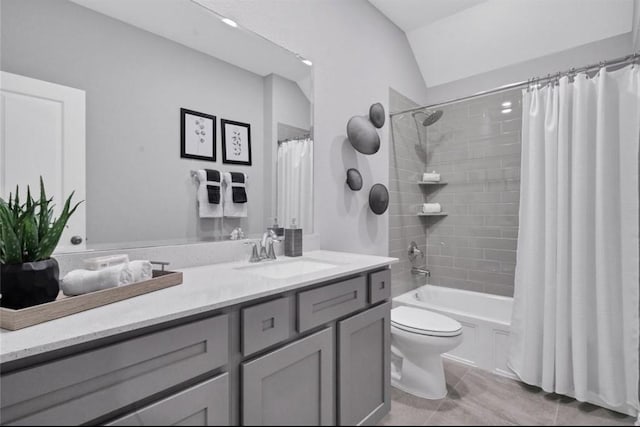 full bath with vaulted ceiling, shower / bath combination with curtain, vanity, and toilet