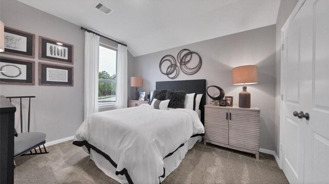 bedroom featuring lofted ceiling and carpet floors