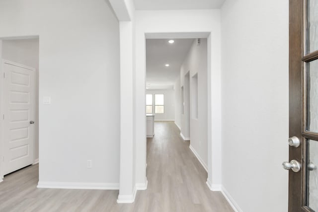 hall with light wood-type flooring