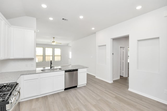 kitchen featuring white cabinetry, appliances with stainless steel finishes, sink, and light hardwood / wood-style floors