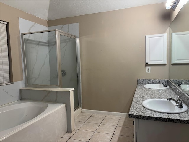 bathroom with vanity, shower with separate bathtub, and tile patterned flooring