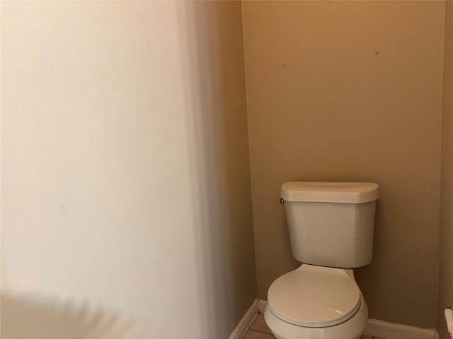 bathroom featuring tile patterned floors and toilet