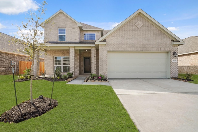 traditional-style house featuring brick siding, an attached garage, concrete driveway, and a front yard