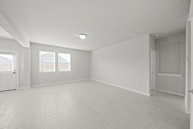 empty room with baseboards