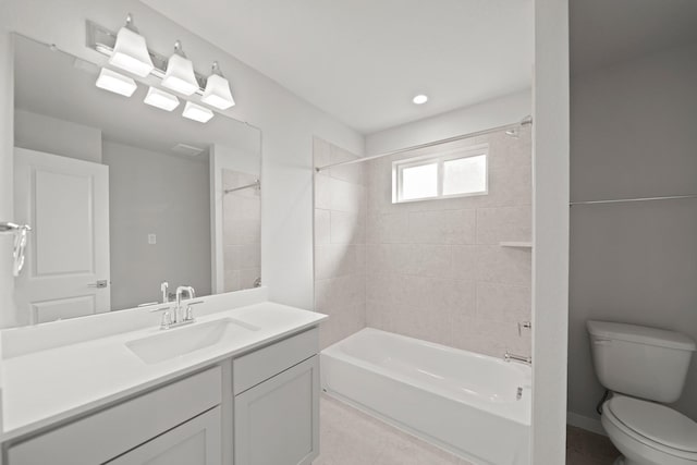 bathroom featuring shower / tub combination, tile patterned floors, toilet, and vanity