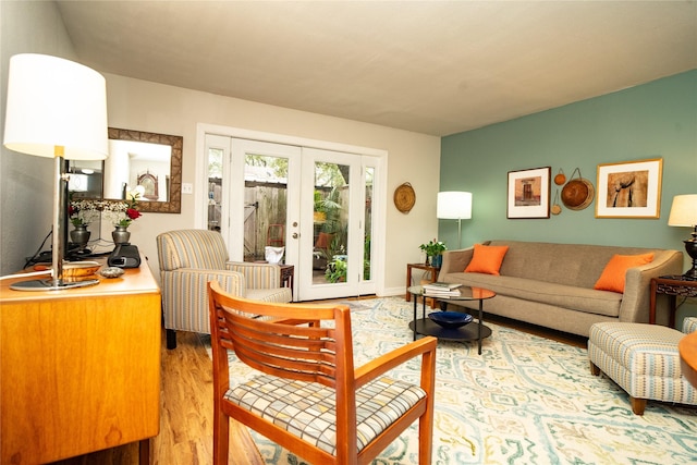 living room with french doors and hardwood / wood-style flooring