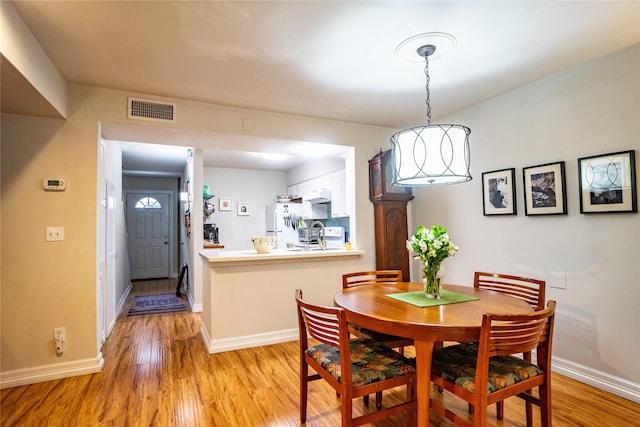 dining room featuring light wood-type flooring