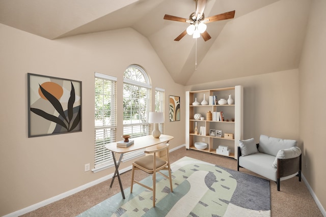 office space featuring lofted ceiling, light carpet, and ceiling fan