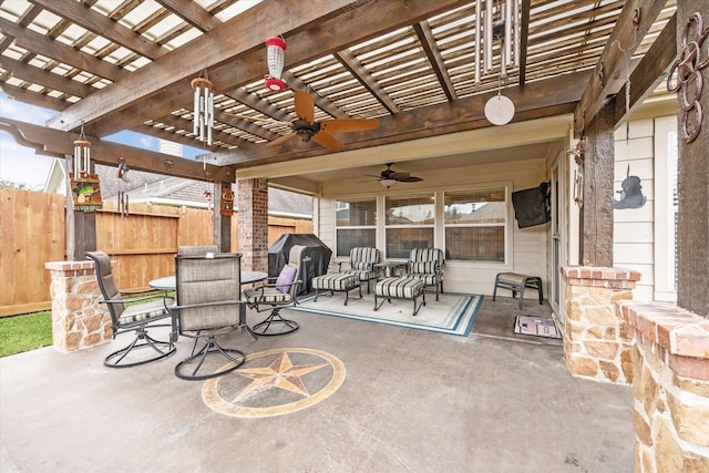 view of patio / terrace featuring area for grilling, ceiling fan, and a pergola