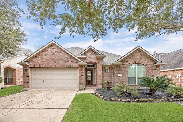 ranch-style house with a garage and a front lawn