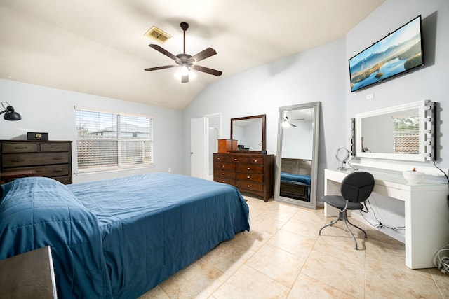 tiled bedroom featuring vaulted ceiling and ceiling fan