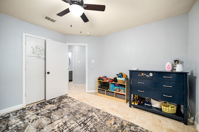 game room featuring light tile patterned flooring and ceiling fan