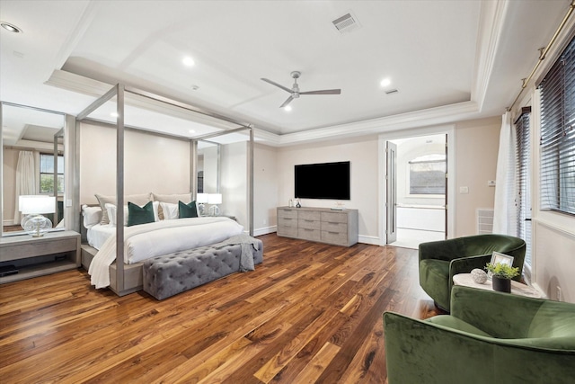 bedroom with visible vents, ornamental molding, wood finished floors, recessed lighting, and a raised ceiling