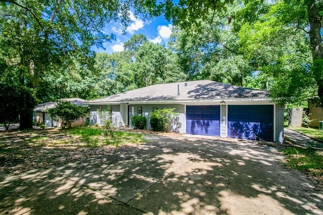 ranch-style home featuring a garage