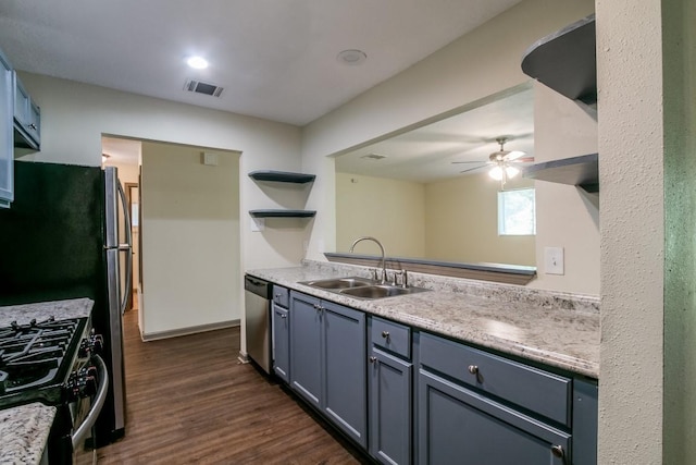 kitchen featuring sink, dishwasher, ceiling fan, dark hardwood / wood-style floors, and range with gas stovetop