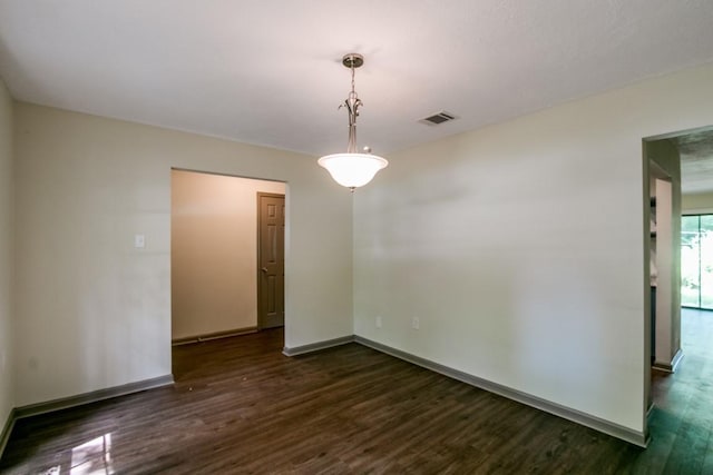 empty room with dark wood-type flooring