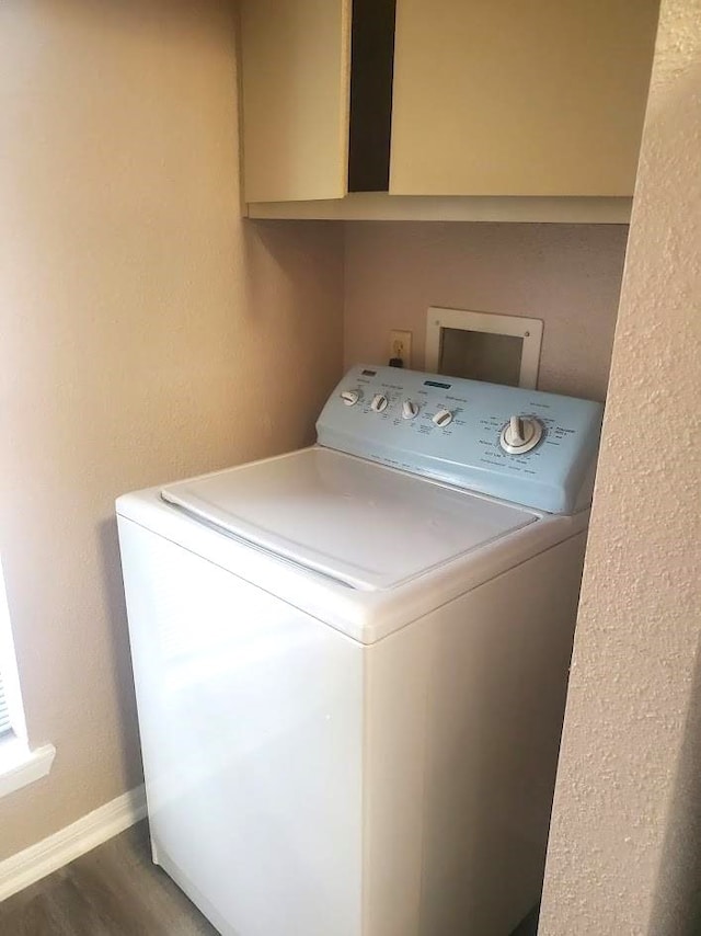 250 El Dorado Unit 296, Webster, TX 77598 - clothes washing area with washer / clothes dryer, wood finished floors, and baseboards