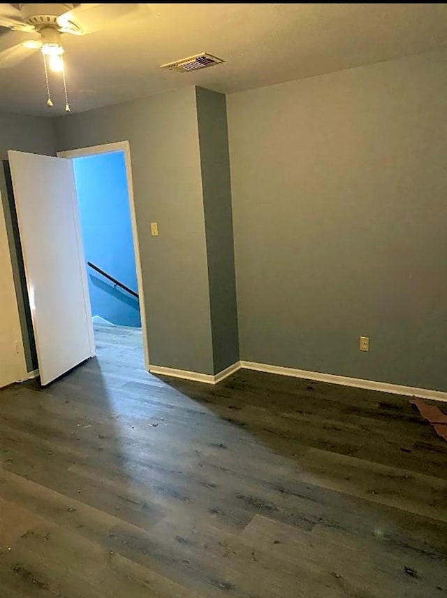 spare room featuring dark hardwood / wood-style floors