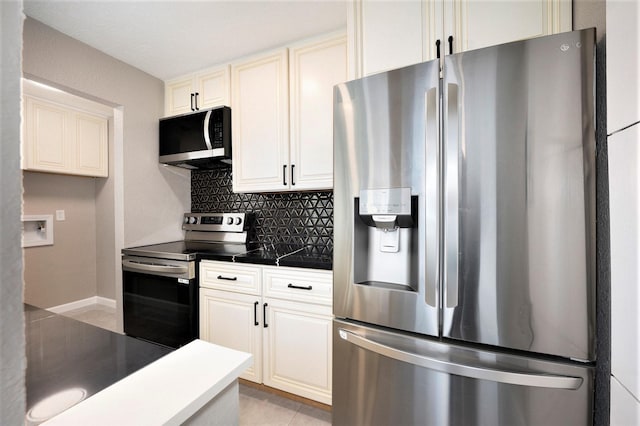 kitchen with light tile patterned floors, decorative backsplash, and appliances with stainless steel finishes