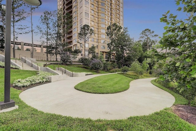 view of property's community featuring a yard