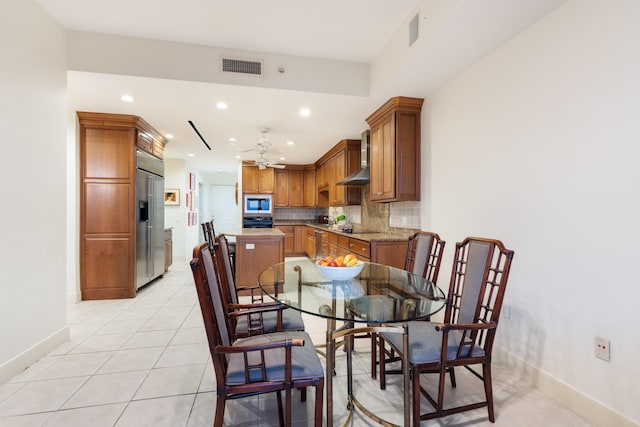 tiled dining room with ceiling fan