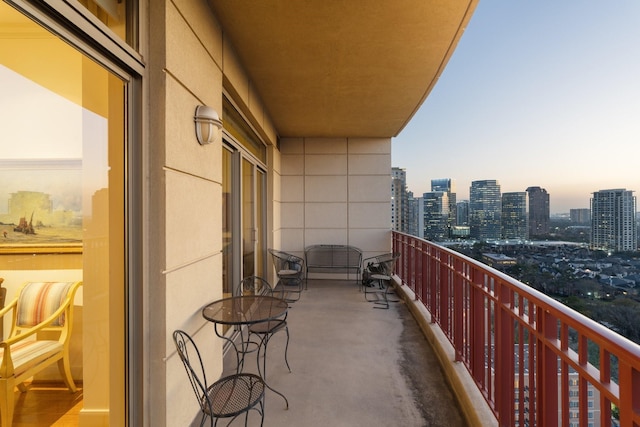 view of balcony at dusk