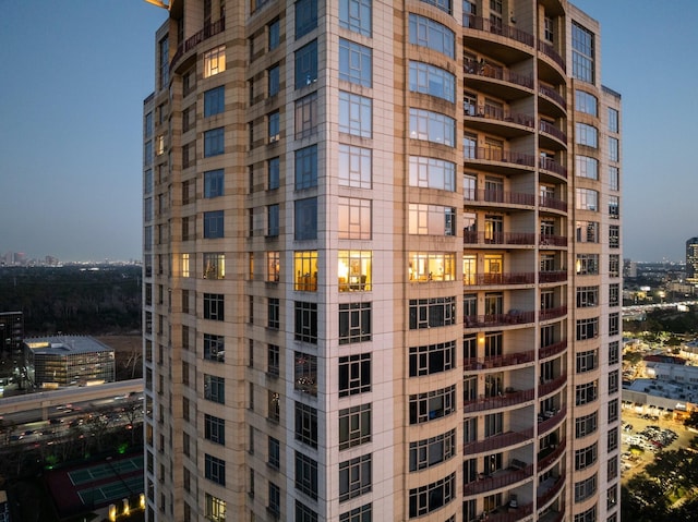 view of outdoor building at dusk