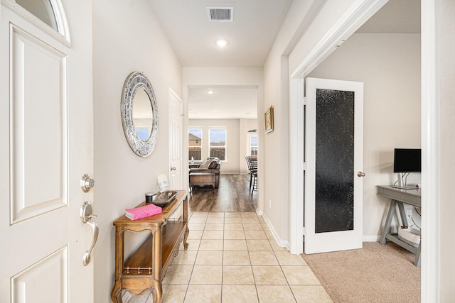 interior space with light tile patterned floors