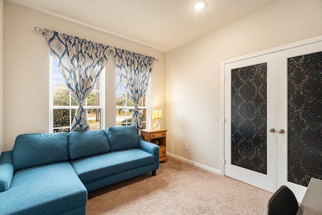 living room featuring carpet floors and french doors