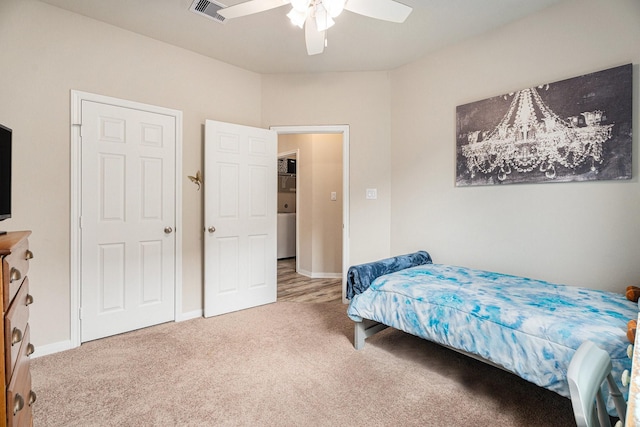 carpeted bedroom with ceiling fan