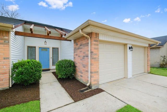 doorway to property featuring a garage