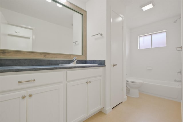 full bathroom featuring vanity, tiled shower / bath combo, and toilet