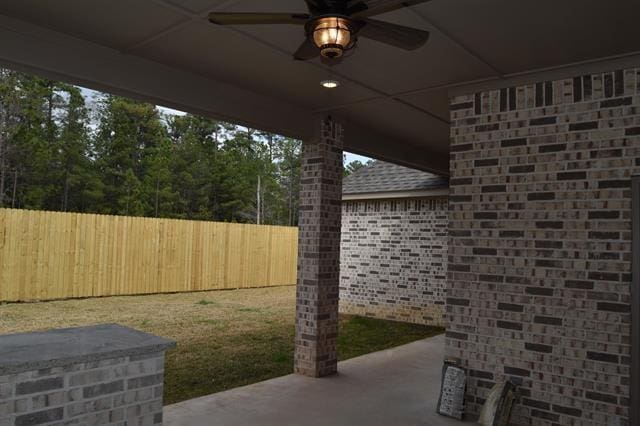 view of patio featuring ceiling fan