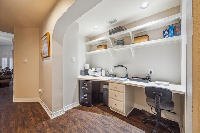 office space with dark wood-type flooring and built in desk