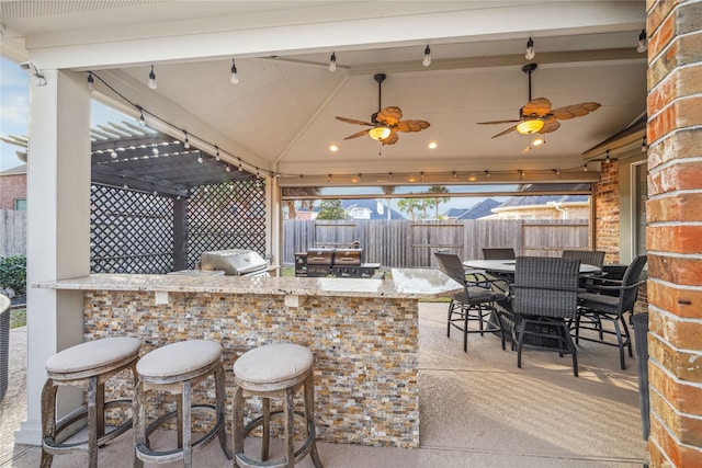 view of patio / terrace featuring area for grilling and exterior bar