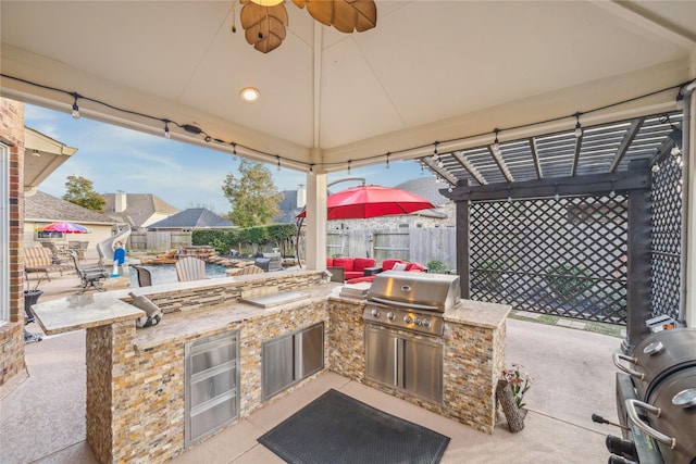 view of patio / terrace with a gazebo, a grill, a pergola, and exterior kitchen