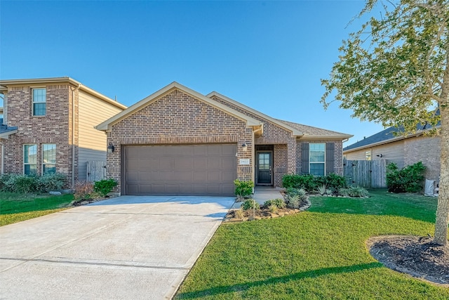 view of front of house with a garage and a front yard