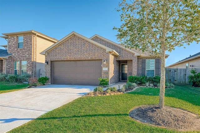 view of front of property with a garage and a front yard