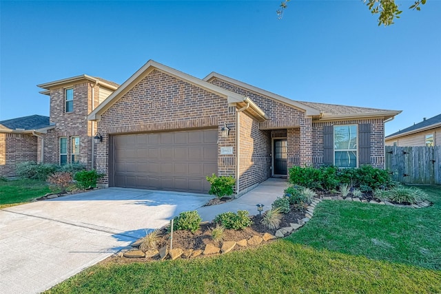 view of front of home with a garage and a front lawn