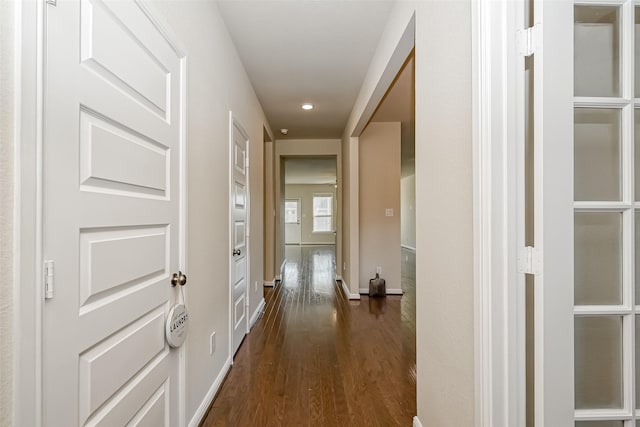 hall with dark hardwood / wood-style floors