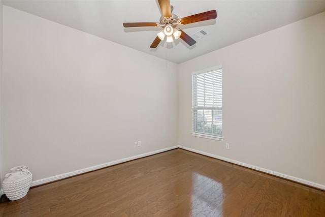 spare room featuring ceiling fan and hardwood / wood-style floors