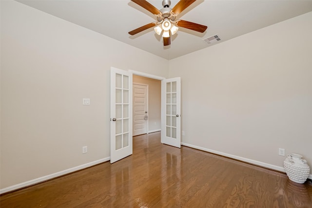 empty room featuring hardwood / wood-style floors, french doors, and ceiling fan