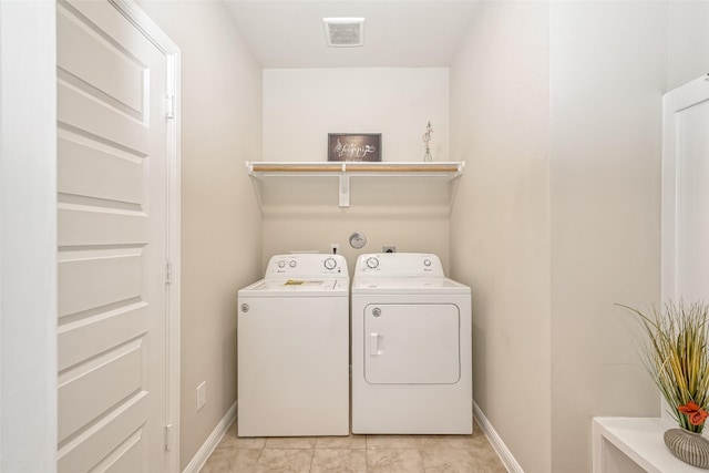 clothes washing area featuring independent washer and dryer