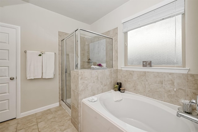 bathroom with tile patterned floors and separate shower and tub