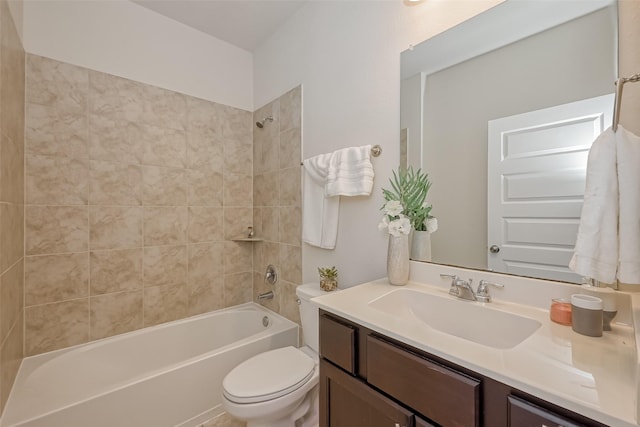 full bathroom with vanity, toilet, and tiled shower / bath