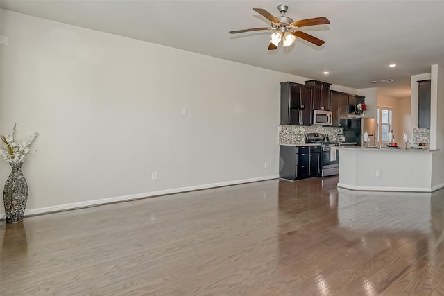 interior space with ceiling fan and wood-type flooring