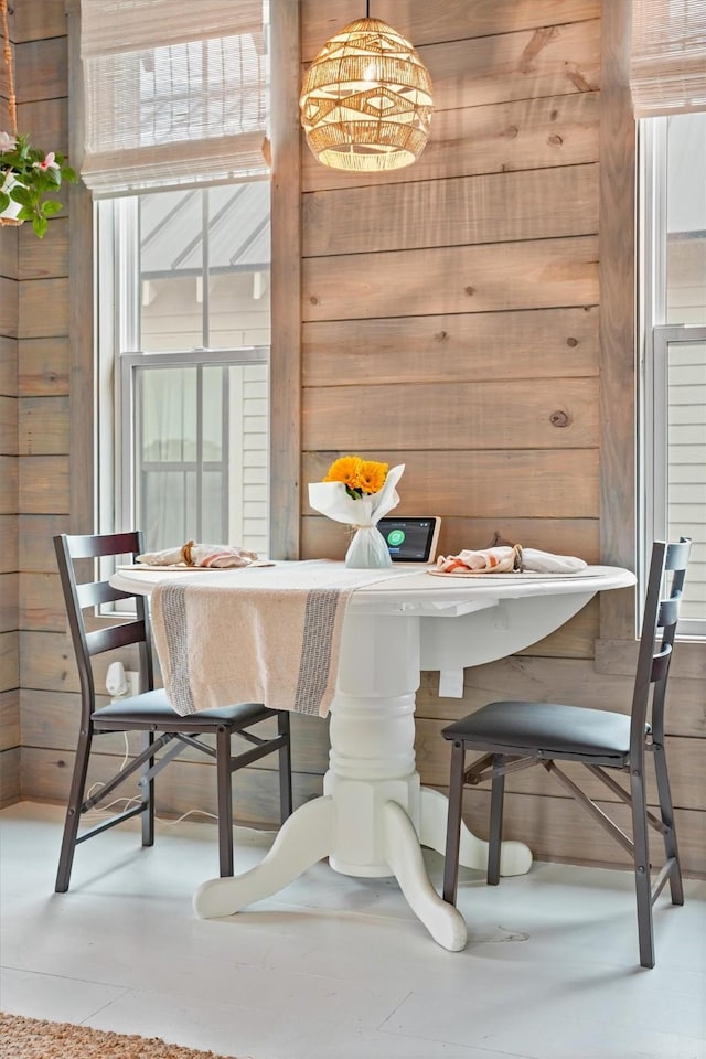 dining area with wooden walls