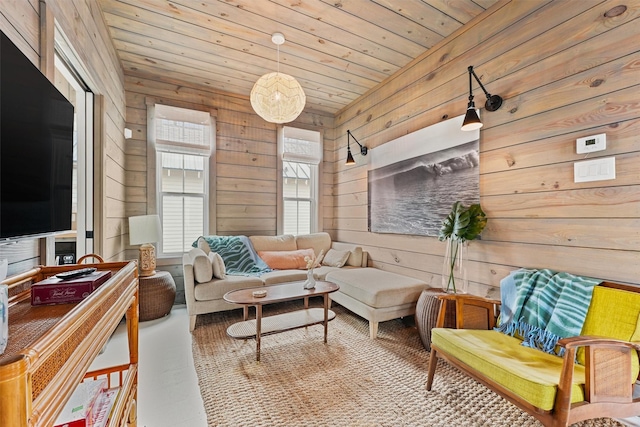 sitting room with wooden ceiling and wood walls