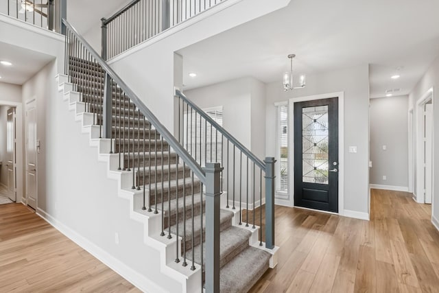 20406 Magnolia Flint Dr, Cypress, TX 77433 - foyer entrance featuring stairs, wood finished floors, a chandelier, and recessed lighting