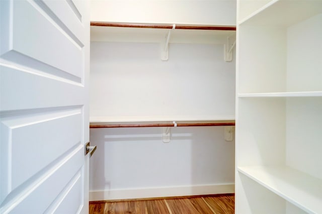 spacious closet with light hardwood / wood-style floors